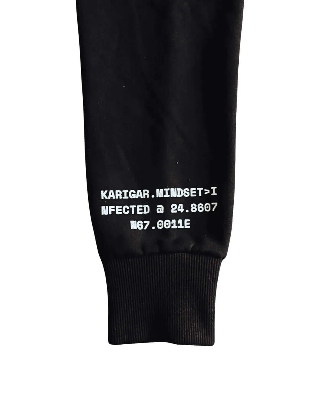 Black sweatshirt sleeve with white text on a white background